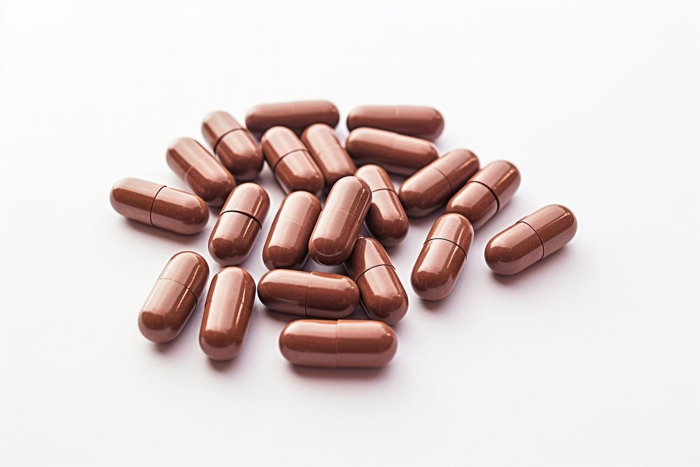 Capsule medicine brown pill white background. AI generated Image by rawpixel.