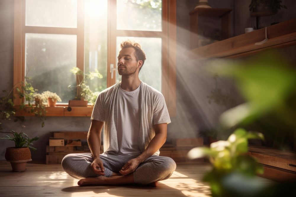 Adult man in morning meditation sitting plant yoga.