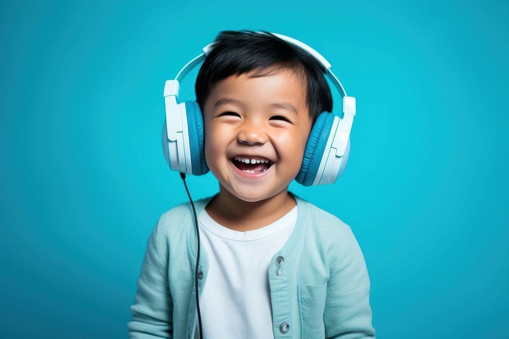 South east asian headphones portrait smiling.