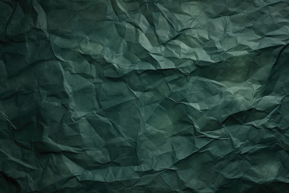 Crumpled Dark green paper Faded paper backgrounds.
