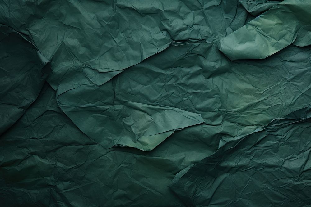Crumpled Dark green paper Faded paper backgrounds.