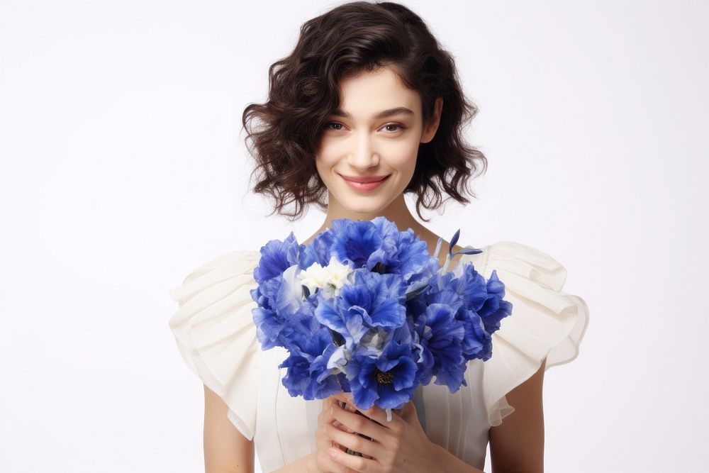 Happy bride holding a blue iris flower bouquet portrait smile white.