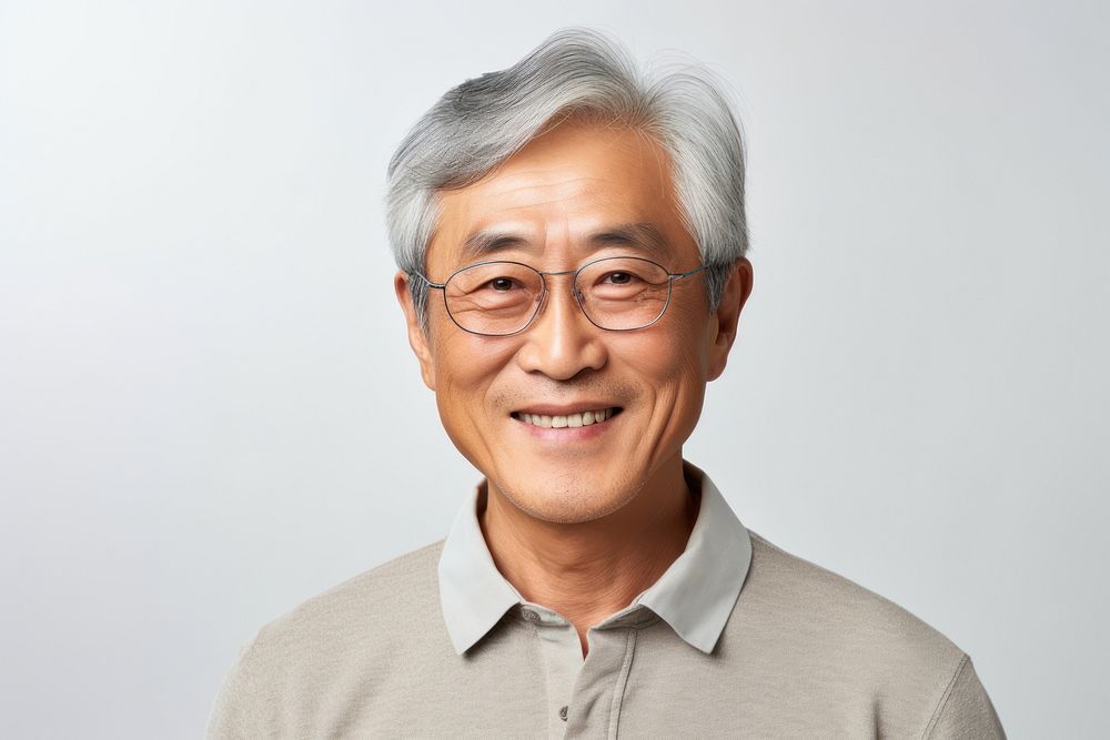 A senior Korean man smiling portrait glasses adult.