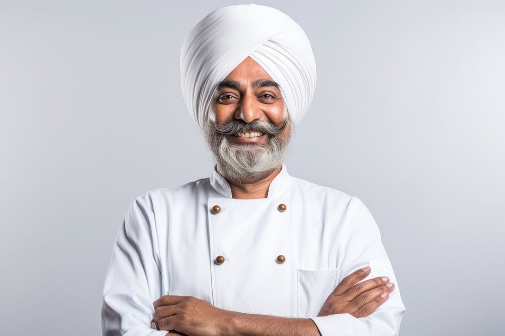 An Indian chef smiling turban adult white background.