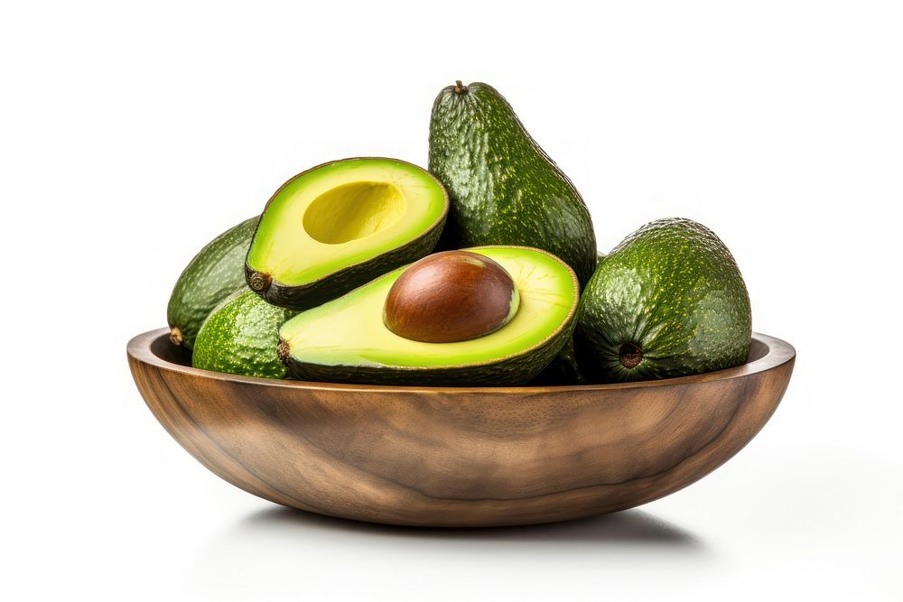 Avocado fruits in a wooden bowl plant food white background.