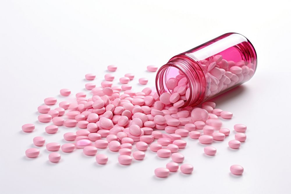 Pink medicine tablets spilled from medicine bottle medication container abundance. AI generated Image by rawpixel.