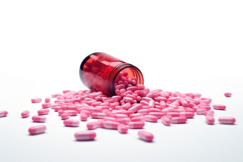 Pink medicine tablets spilled from medicine bottle white background medication container. AI generated Image by rawpixel.