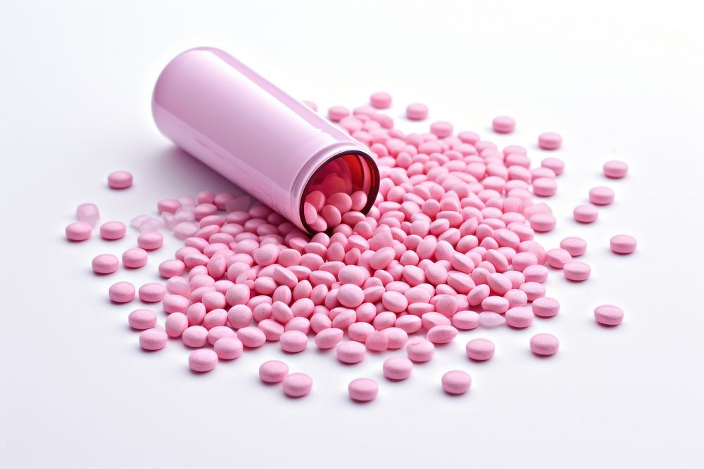 Pink medicine tablets spilled from medicine bottle antioxidant medication abundance. AI generated Image by rawpixel.