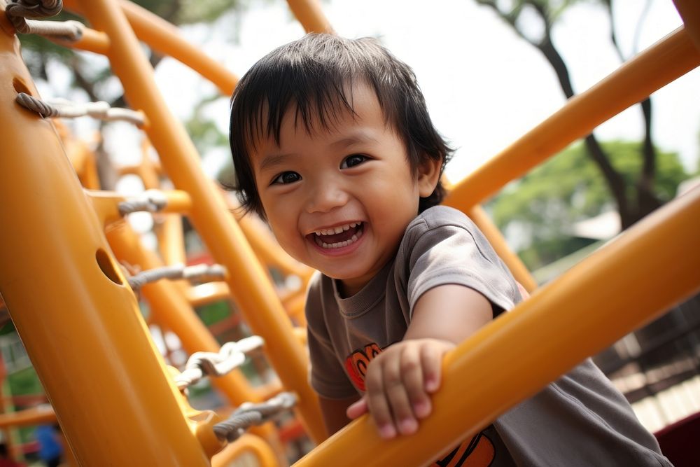 Indonesian kid playground portrait outdoors.