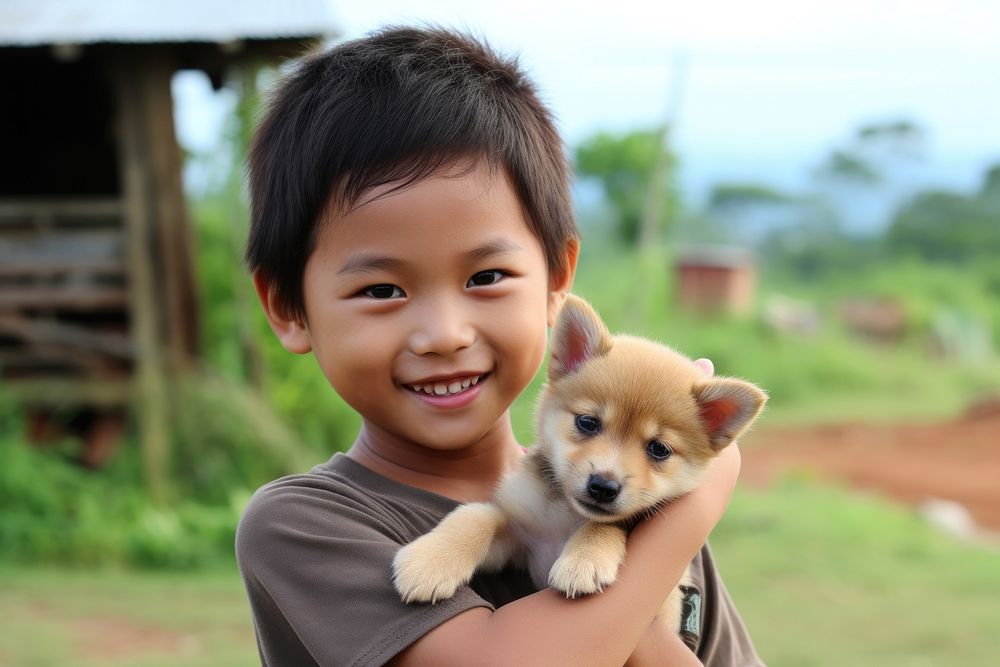 Malaysian kid puppy outdoors portrait.
