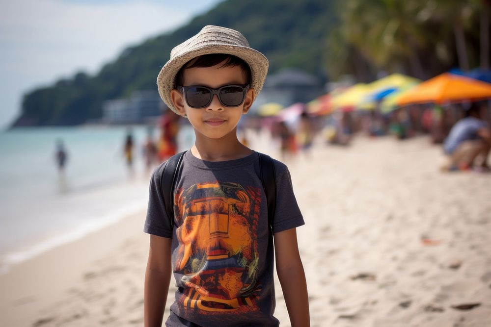 Malaysian kid beach sunglasses portrait.