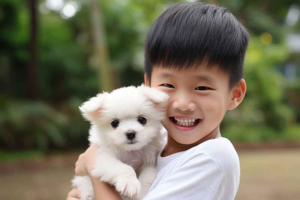 Singaporean kid puppy portrait holding.