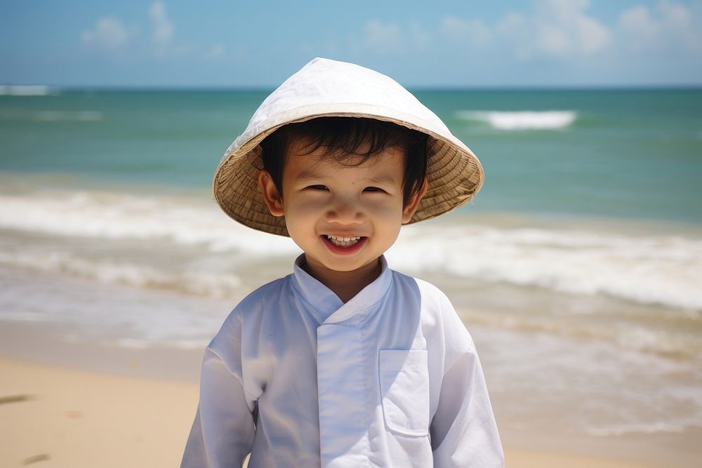 Vietnamese kid beach portrait outdoors.