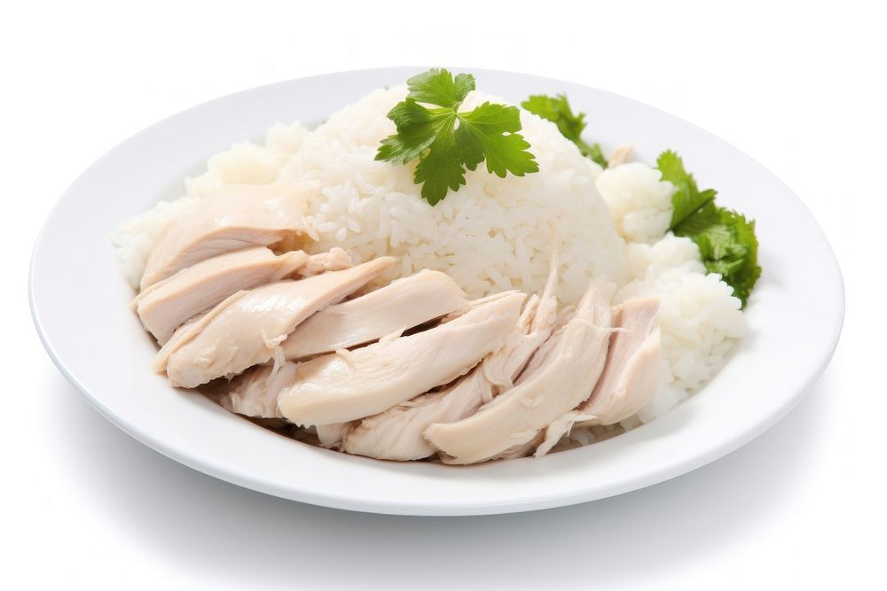 Steamed rice topped with chicken plate herbs food.