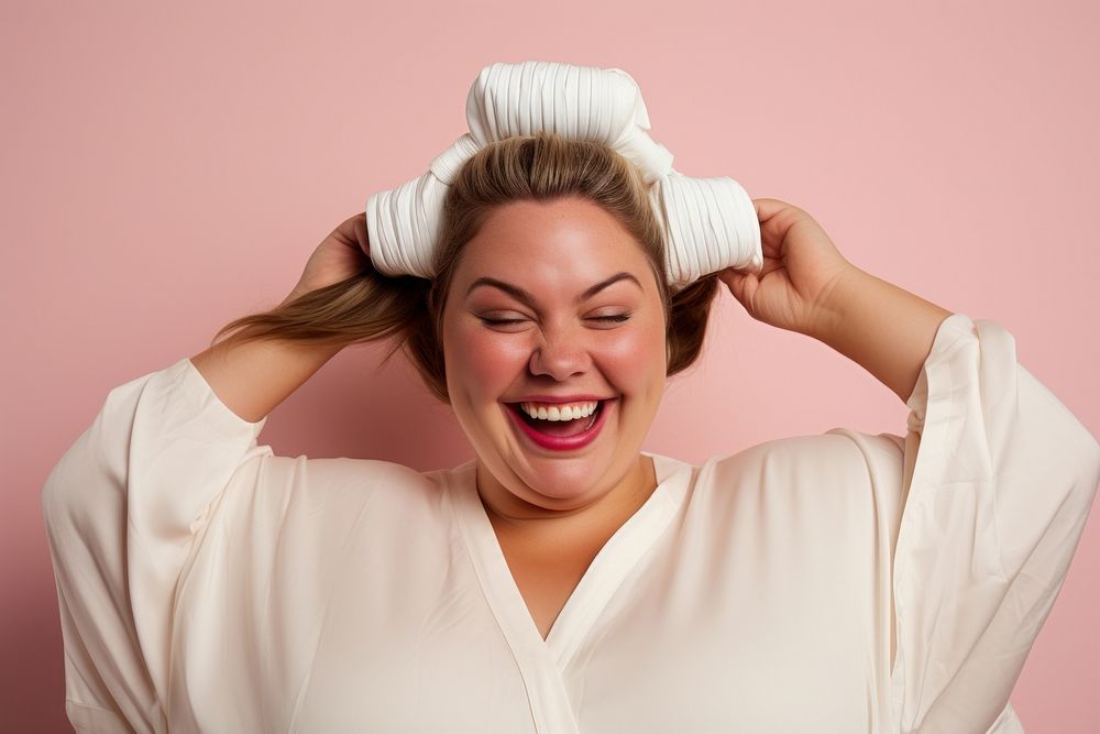 Chubby woman tying her hair with rubber band smile laughing adult. AI generated Image by rawpixel.