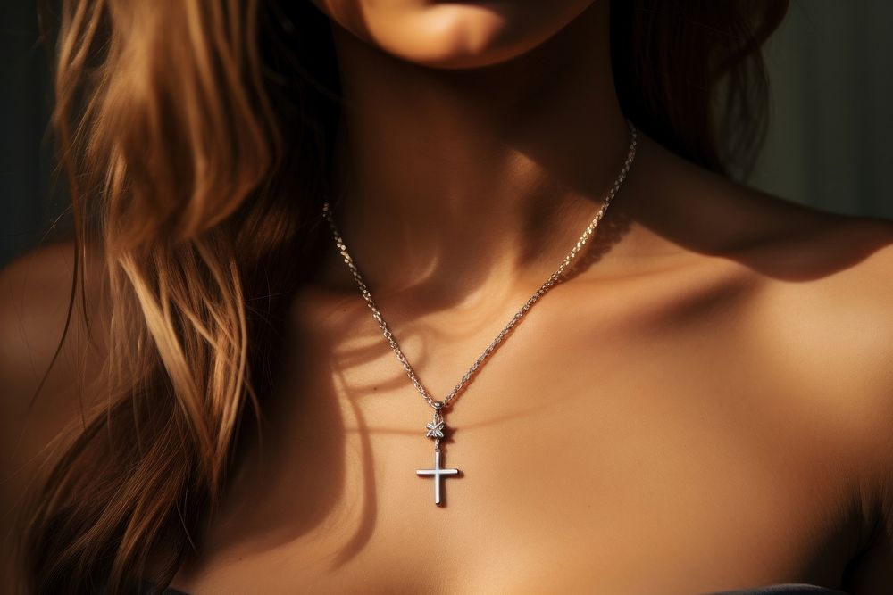 Cross necklace on woman jewelry pendant spirituality. AI generated Image by rawpixel.