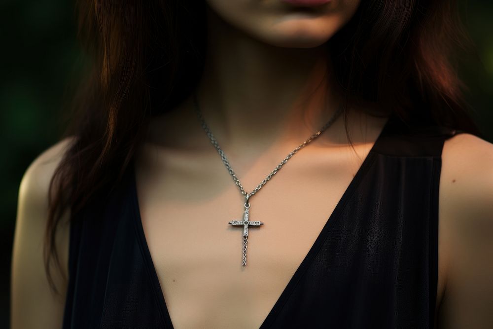 Cross necklace on woman jewelry pendant accessories. AI generated Image by rawpixel.