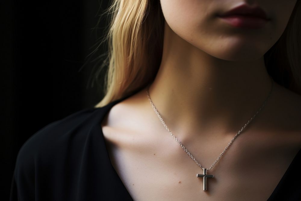 Cross necklace on woman jewelry pendant adult. AI generated Image by rawpixel.
