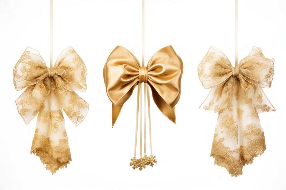 Golden lace ribbon bows hanging white background celebration.