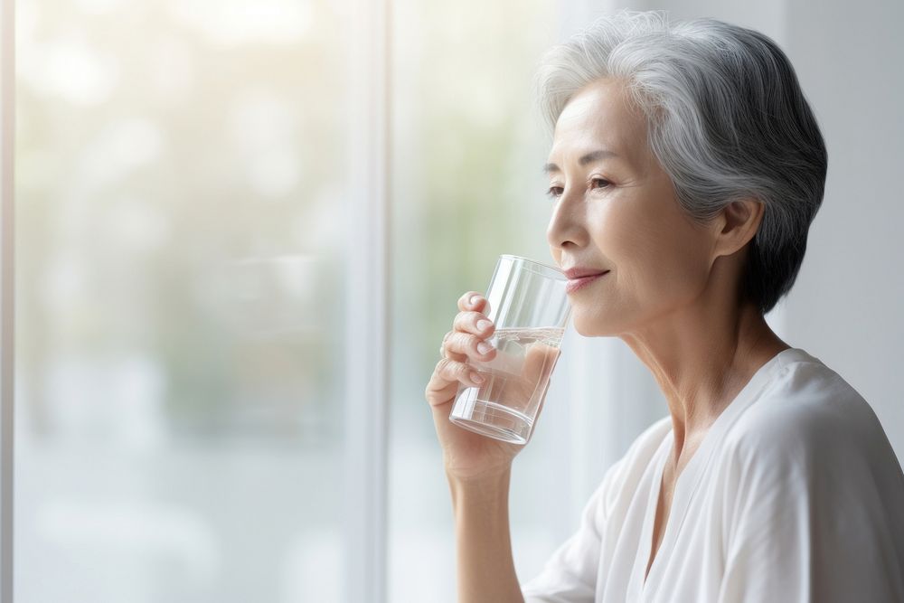 Woman drinking water adult contemplation refreshment. AI generated Image by rawpixel.
