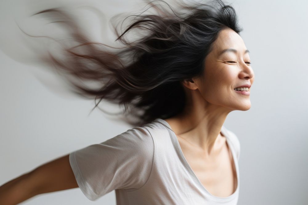 Mature asian american woman dancing adult relaxation. AI generated Image by rawpixel.