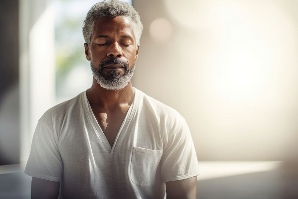 Mature guy meditating adult contemplation relaxation. AI generated Image by rawpixel.