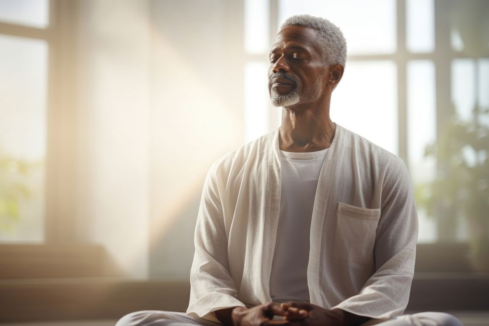 Mature guy meditating adult contemplation spirituality. AI generated Image by rawpixel.