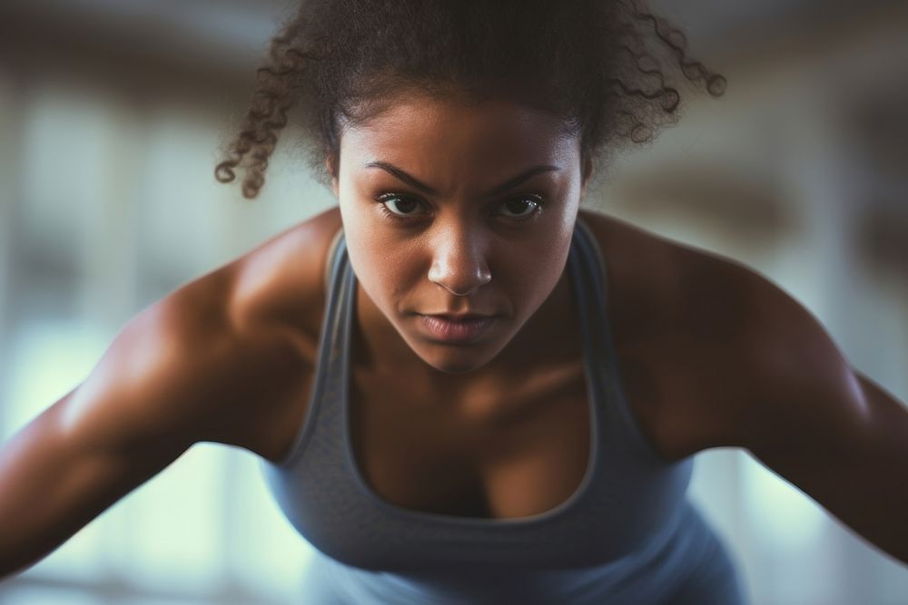 Plump girl working out determination concentration bodybuilding. AI generated Image by rawpixel.