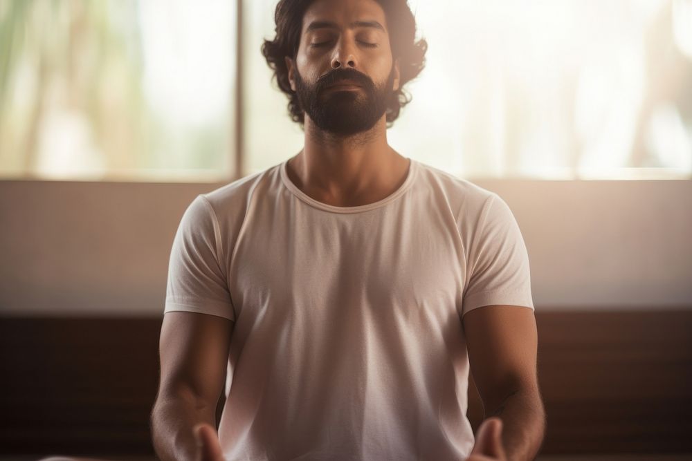 Indian guy does yoga adult contemplation cross-legged. AI generated Image by rawpixel.