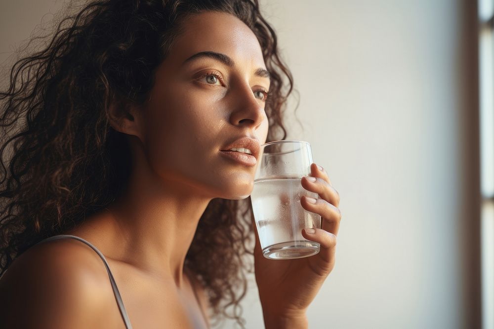 Mature woman drinking water portrait adult photo. AI generated Image by rawpixel.