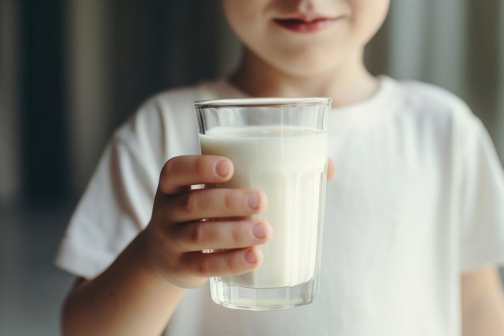 Little kid drinking milk dairy refreshment milkshake. AI generated Image by rawpixel.