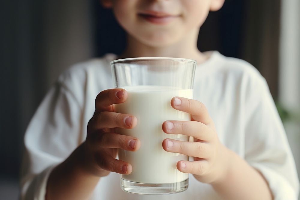 Little kid drinking milk dairy food refreshment. AI generated Image by rawpixel.