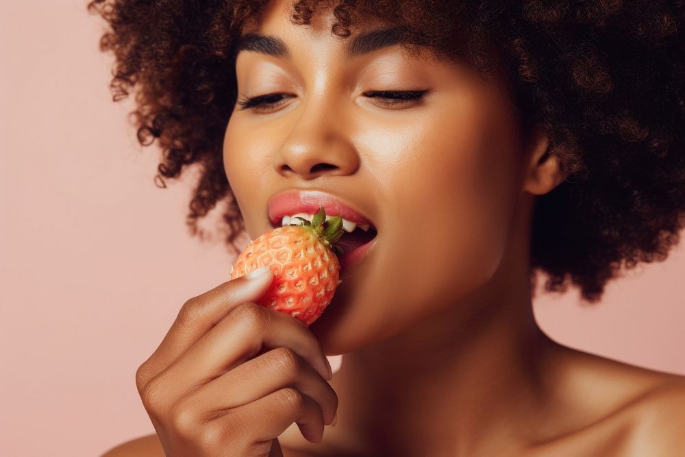 Eating strawberry biting adult fruit. AI generated Image by rawpixel.