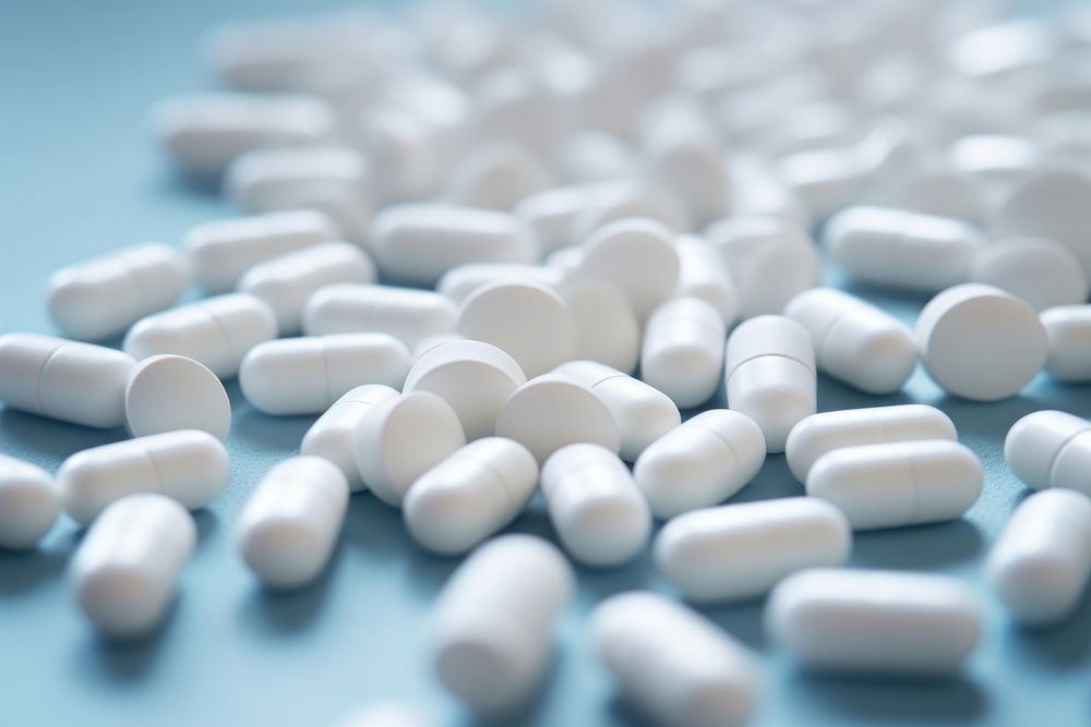 Vitamin tablets and capsuls backgrounds pill medication. AI generated Image by rawpixel.