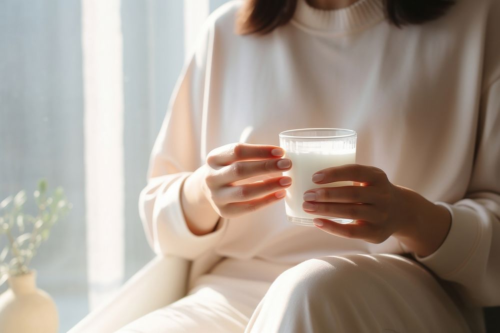 Woman having supplement drink milk refreshment. AI generated Image by rawpixel.