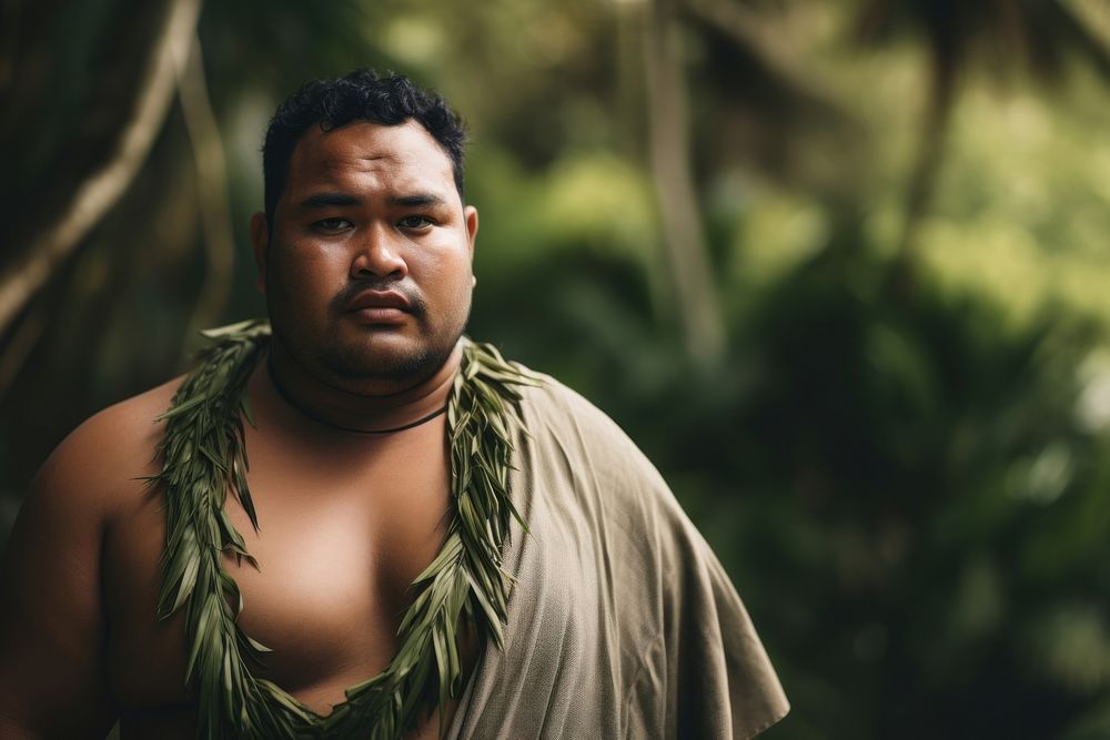 A chubby Micronesian male in traditional cloth adult tribe contemplation.