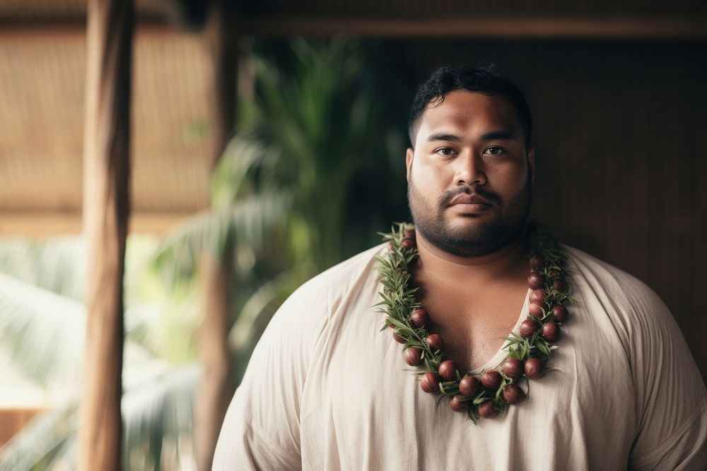 A chubby Micronesian male in traditional cloth portrait necklace jewelry.