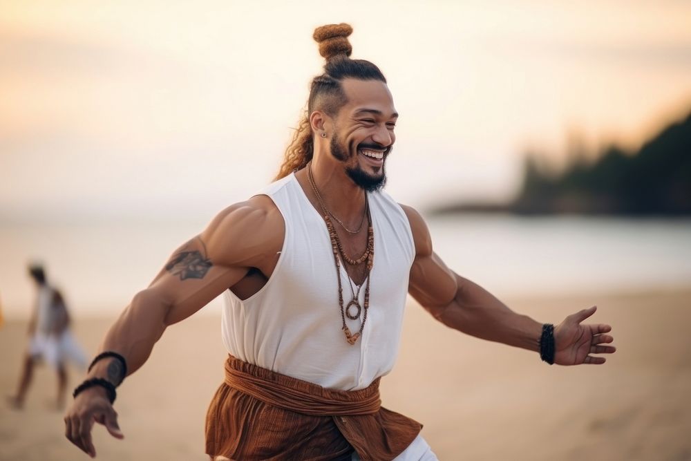 A muscular Micronesian male enjoy dance beach adult smile.