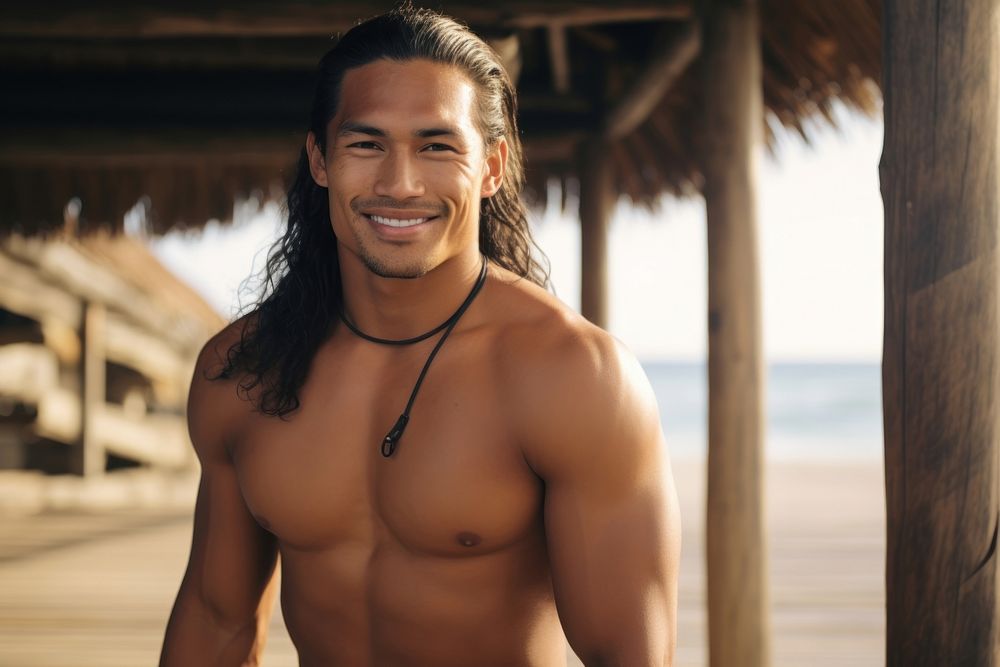 A muscular Pacific Islander male enjoy dance smile beach happy.