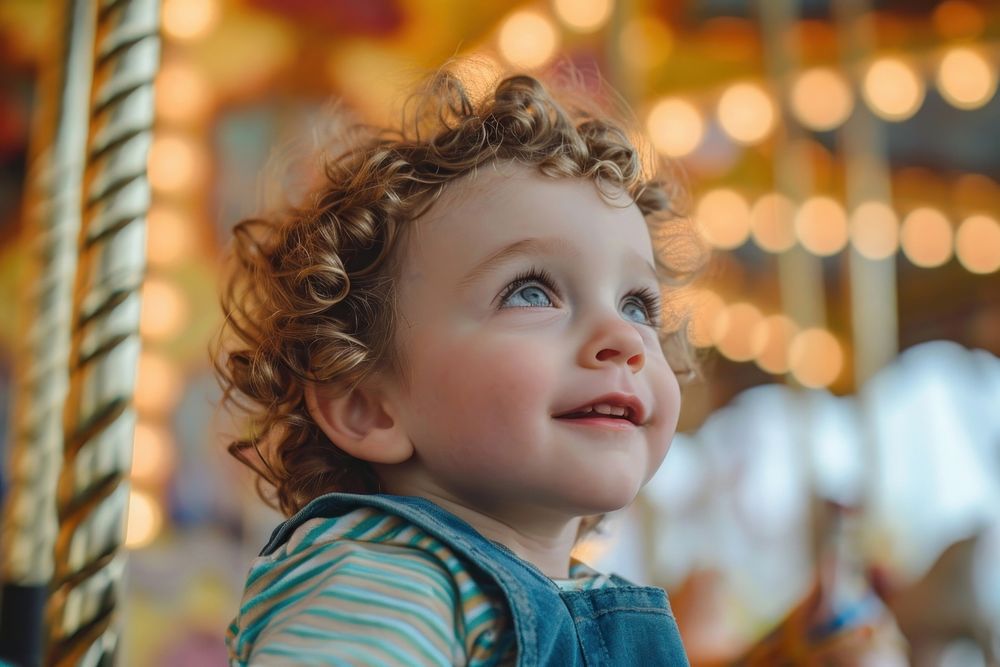 Toddler carousel portrait looking.