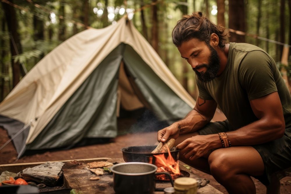 Camping Brazillian man outdoors tent.