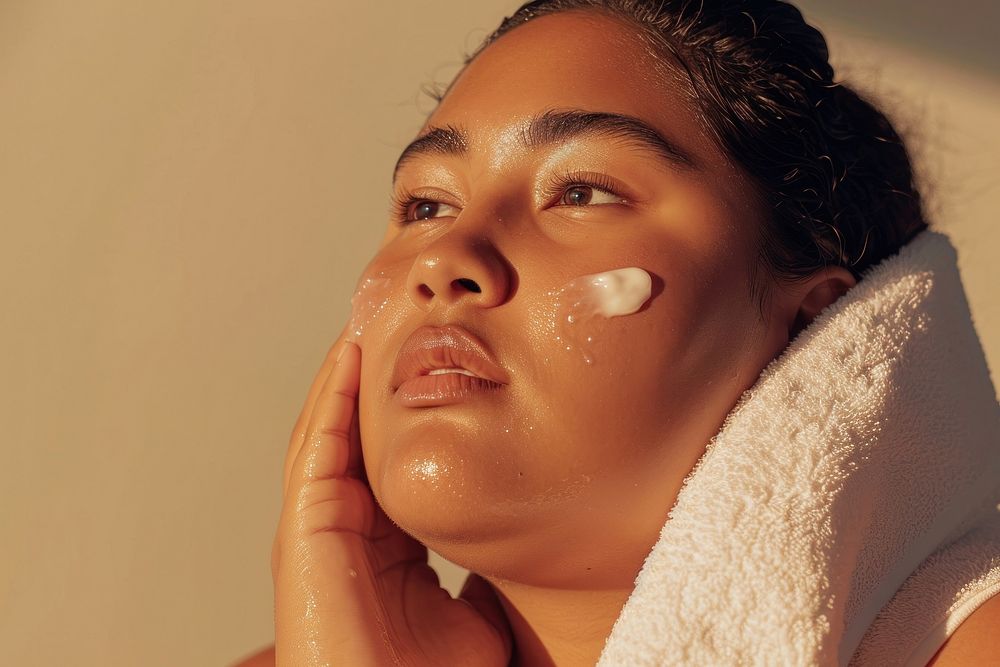 Chubby Tonga woman doing skincare routine adult relaxation applying.