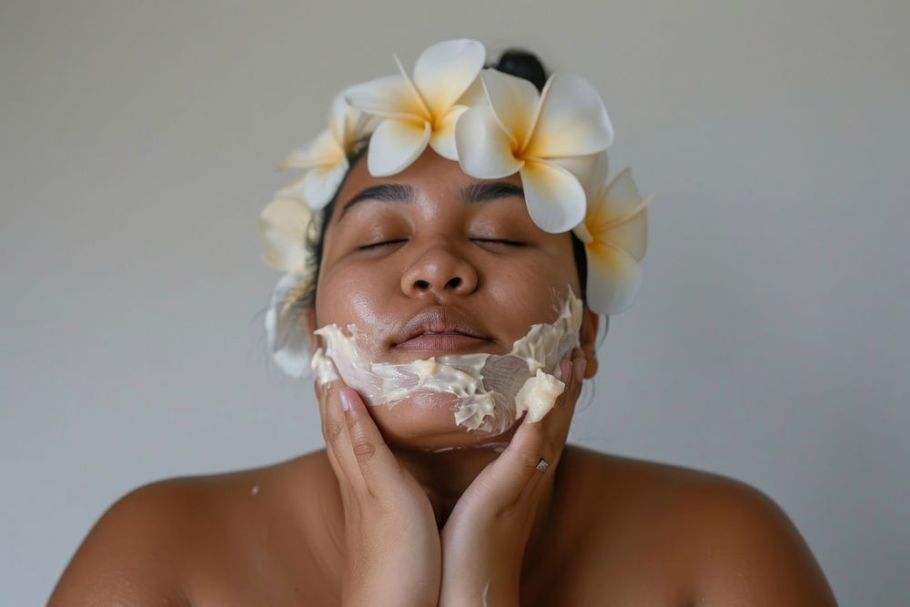 Chubby Micronesian woman doing skincare routine hairstyle headpiece headshot.