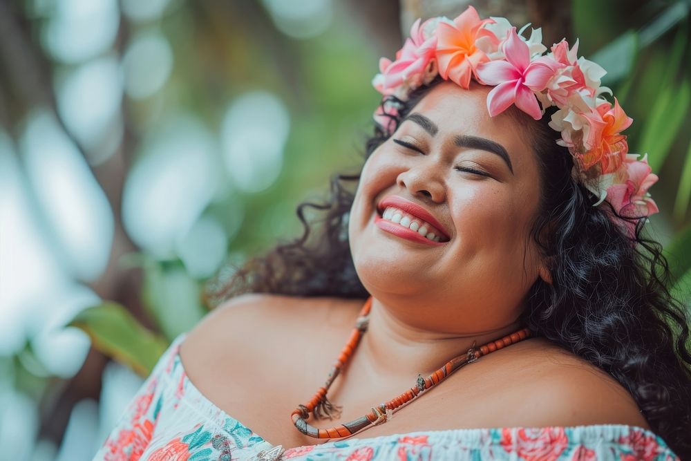 A chubby Micronesian womans with cosmetic laughing necklace flower.