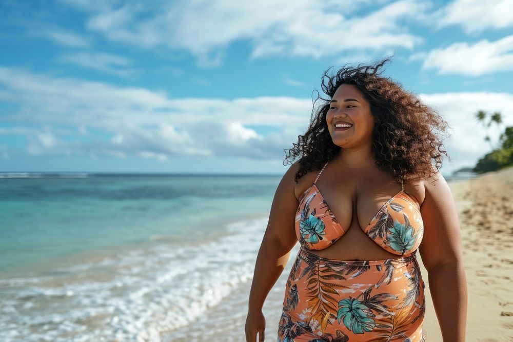 Chubby Pacific Islander woman walk on the beach outdoors adult happy.