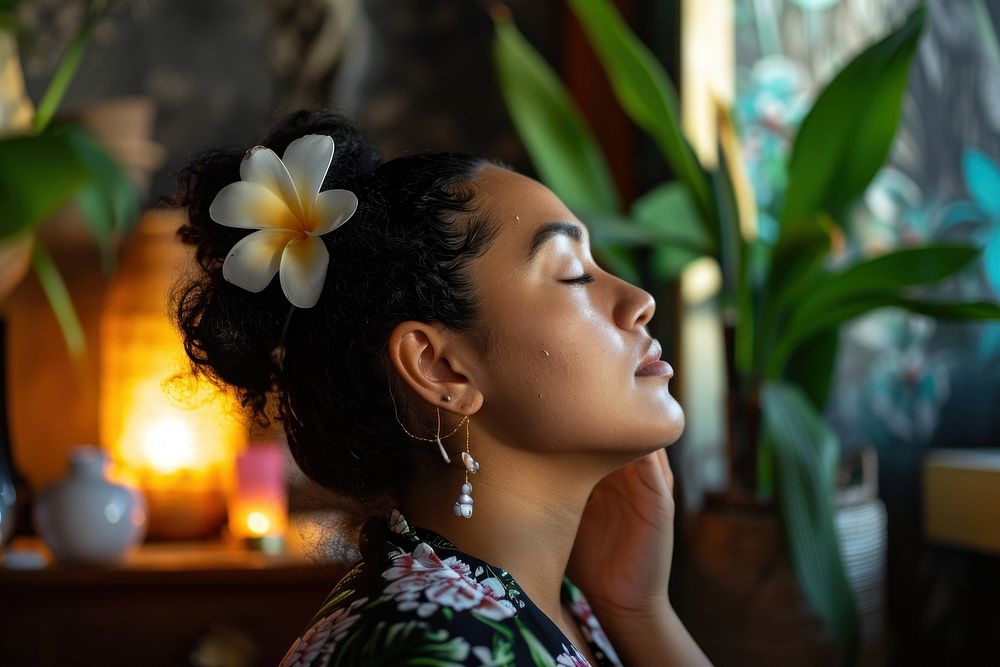 Samoan woman doing skincare routine portrait earring jewelry.