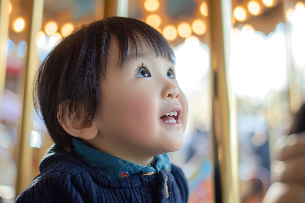 Asian toddler portrait cheerful carousel.