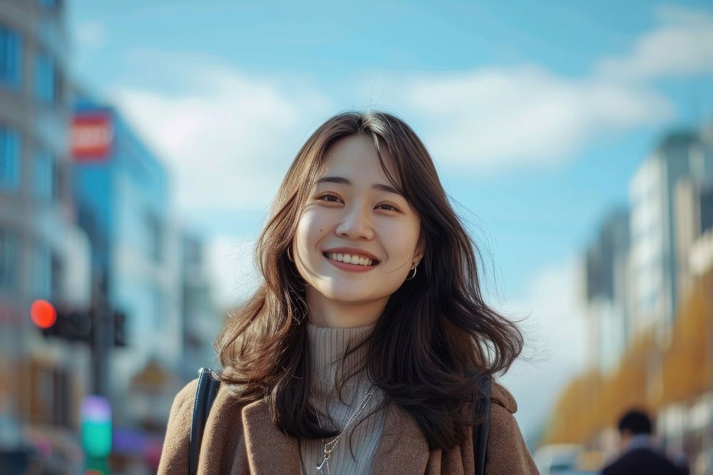 Asian woman standing portrait smiling.
