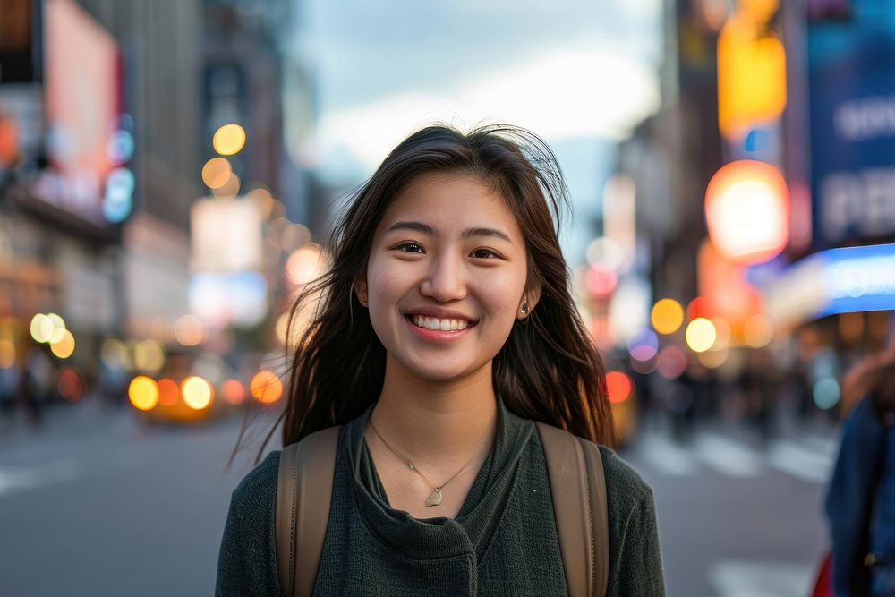 Asian woman standing portrait smiling.