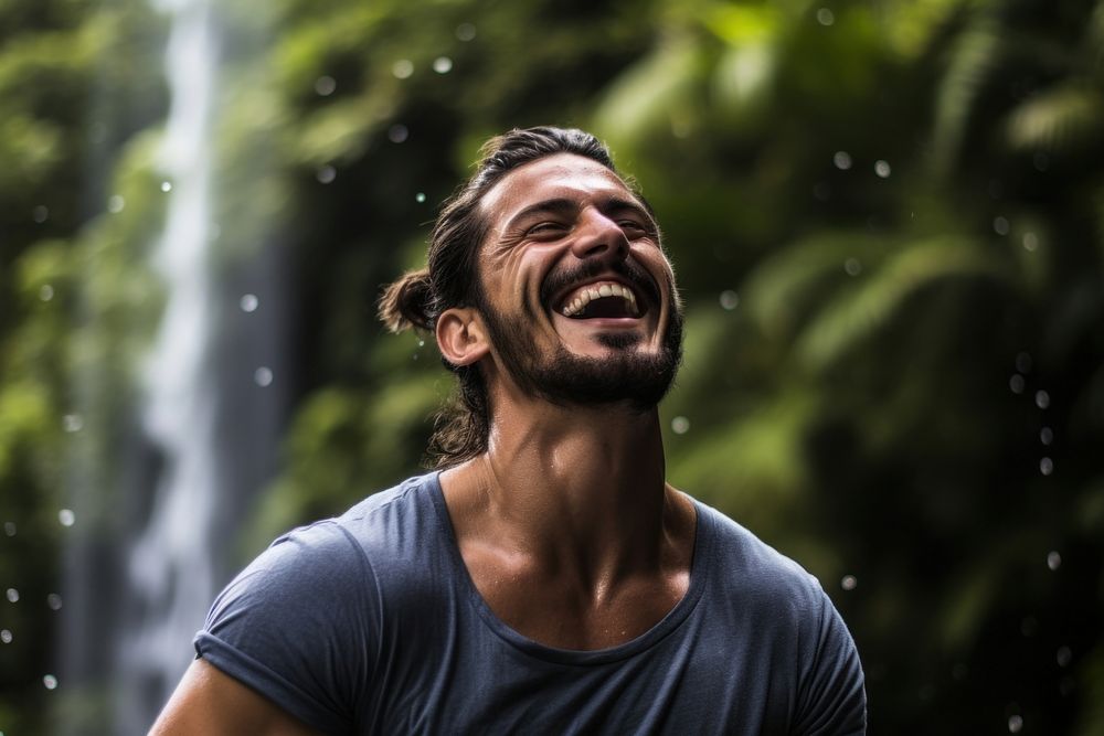 Latino waterfall laughing outdoors.
